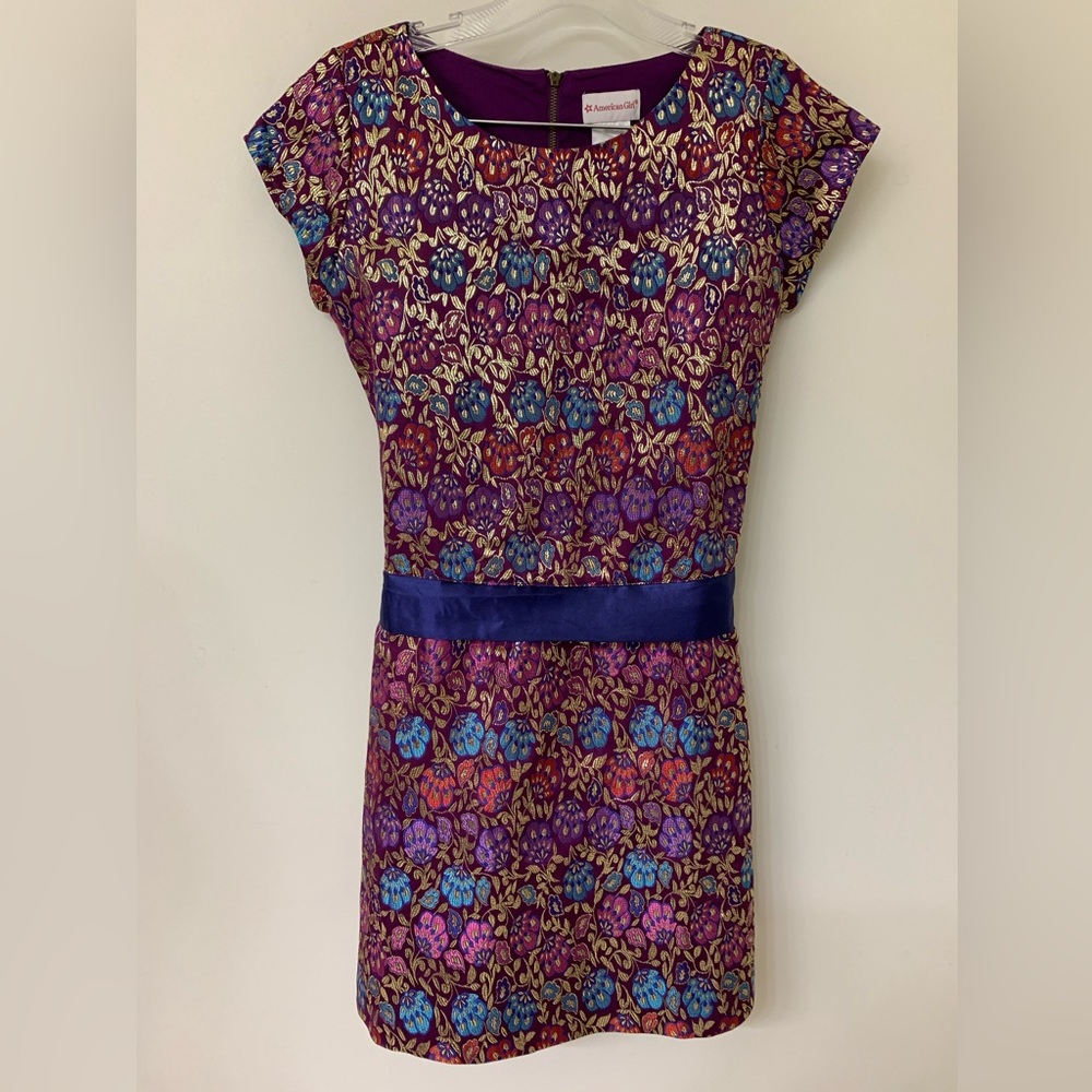 Pre-owned AMERICAN GIRL size 16 colorful floral metallic dress with a blue sash.